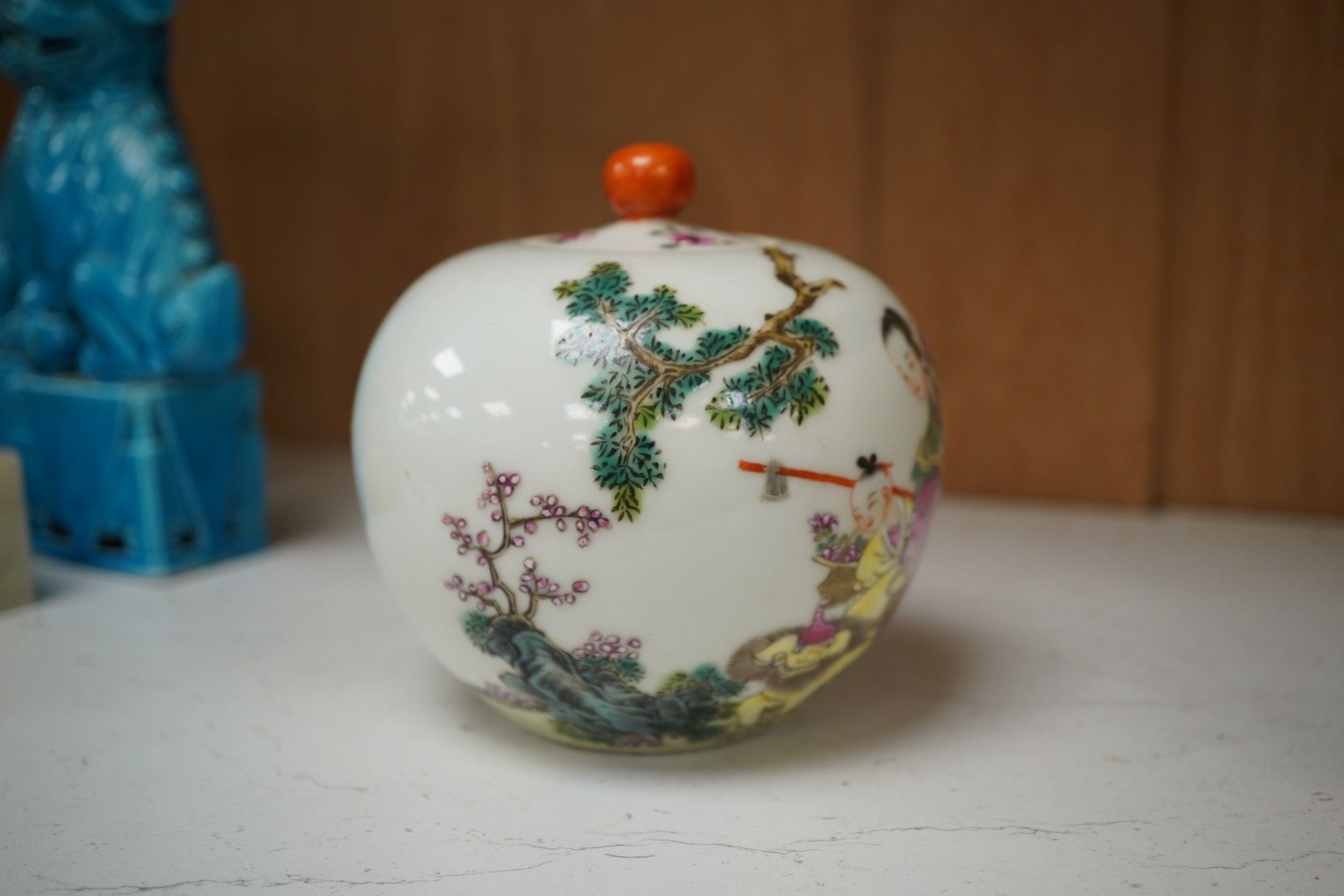 A famille rose bullet shape jar and cover, 10cm high. Condition - fair to good